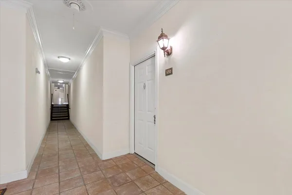 a view of a hallway with closet