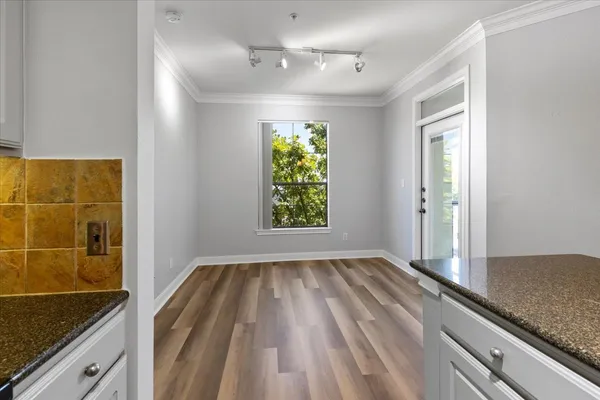 a view of hallway with natural light