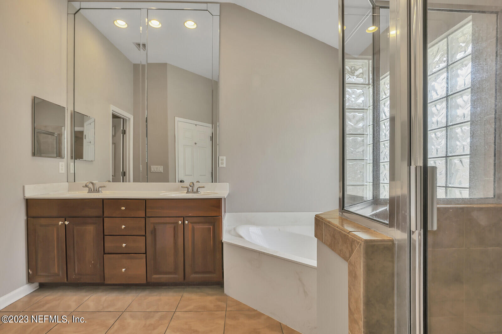 860 Briarcreek Road Jacksonville, FL 32225 - Photo 14 of 24 a spacious bathroom with a tub sink and mirror