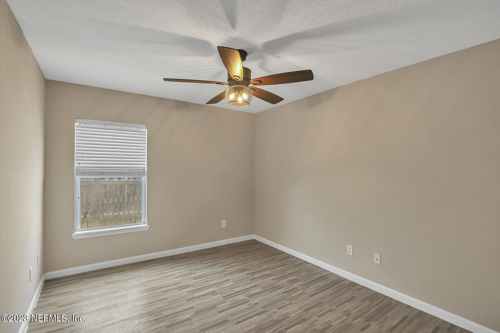860 Briarcreek Road Jacksonville, FL 32225 - Photo 18 of 24 wooden floor in an empty room with a window