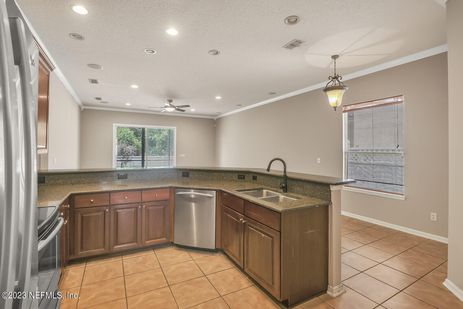 860 Briarcreek Road Jacksonville, FL 32225 - Photo 5 of 24 a kitchen with a sink stove and cabinets