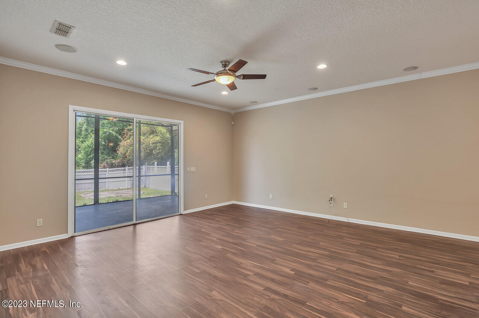 860 Briarcreek Road Jacksonville, FL 32225 - Photo 9 of 24 wooden floor in an empty room with a window