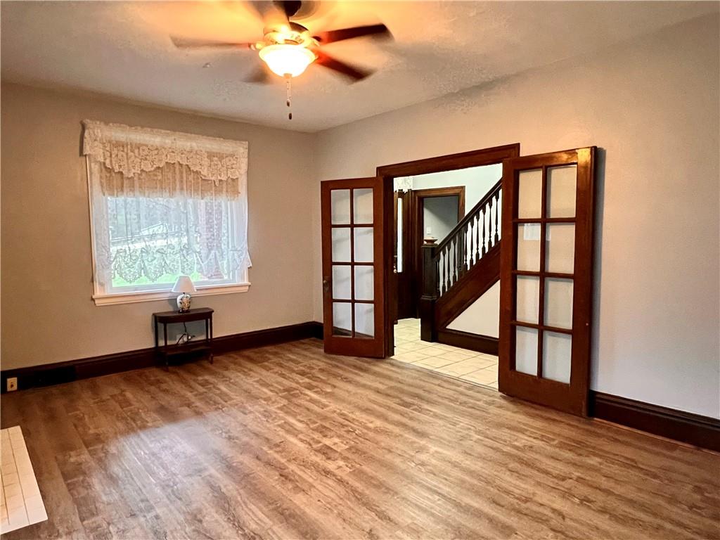 1299 Old State Road Apollo, PA 15613 - Photo 17 of 29 a view of an empty room with wooden floor and a window