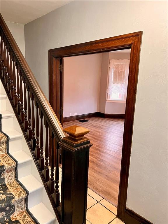 1299 Old State Road Apollo, PA 15613 - Photo 24 of 29 a view of a hallway with wooden floor and staircase