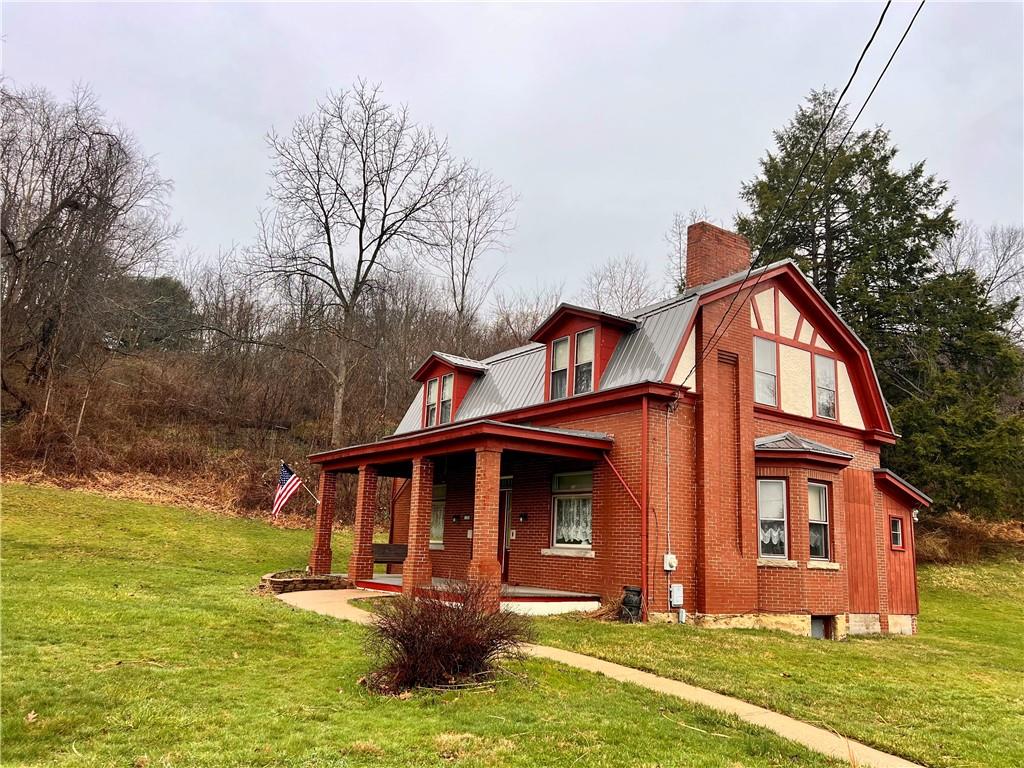 1299 Old State Road Apollo, PA 15613 - Photo 3 of 29 a front view of a house with garden
