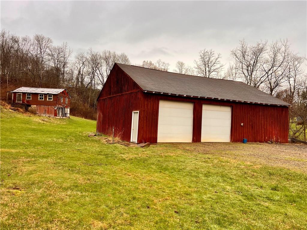 1299 Old State Road Apollo, PA 15613 - Photo 4 of 29 a view of a house with a yard and garage