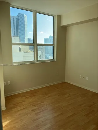 a view of an empty room with a window