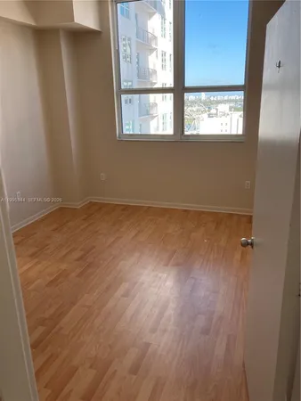 a view of an empty room with a window