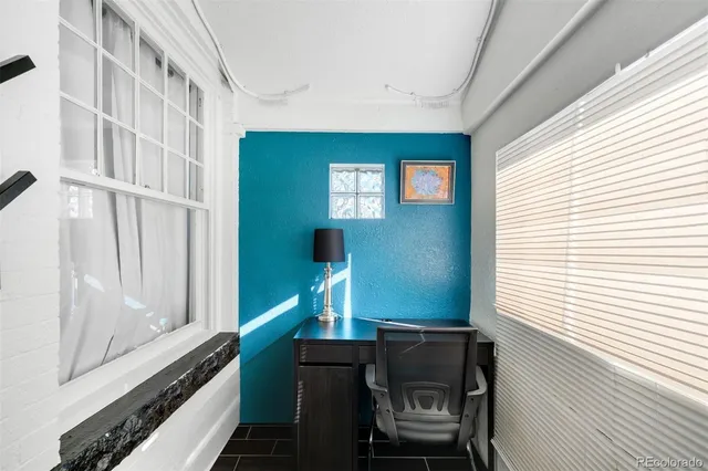 a view of a hallway with windows