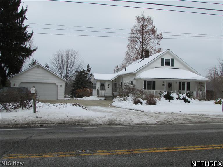 3857 South Ridge Road Perry, OH 44081 - Photo 2 of 25 An oversize two car garage, sunroom, front porch and back deck provide plenty of room for entertaining.