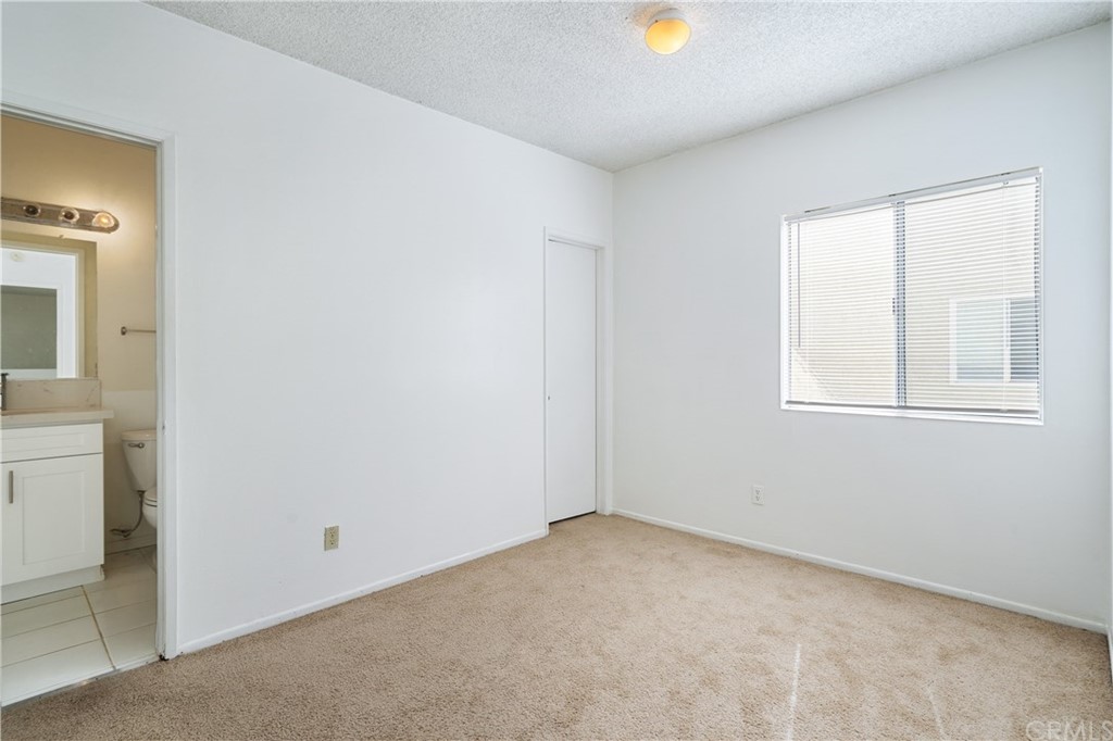 331 South New Avenue, Unit H Monterey Park, CA 91755 - Photo 12 of 26 an empty room with windows and closet