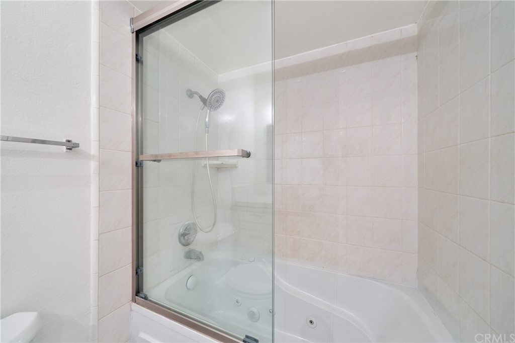 331 South New Avenue, Unit H Monterey Park, CA 91755 - Photo 19 of 26 a bathroom with a glass shower door