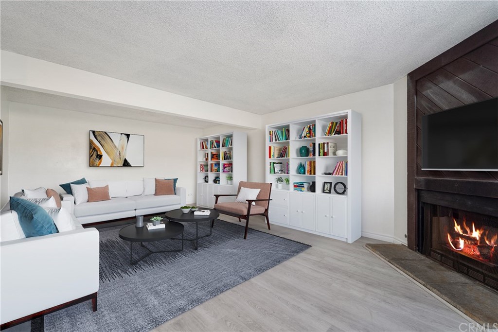 331 South New Avenue, Unit H Monterey Park, CA 91755 - Photo 2 of 26 a living room with furniture and a fireplace
