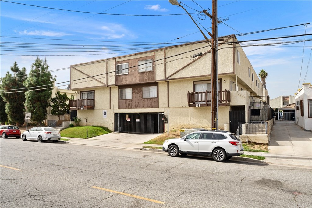 331 South New Avenue, Unit H Monterey Park, CA 91755 - Photo 24 of 26 a view of a cars parked in front of a building