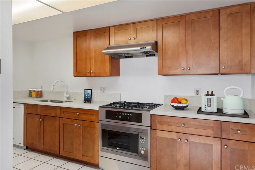 331 South New Avenue, Unit H Monterey Park, CA 91755 - Photo 7 of 26 a kitchen with cabinets appliances and a sink
