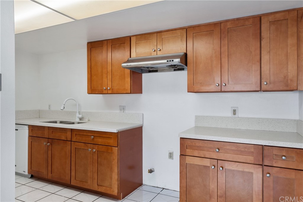 331 South New Avenue, Unit H Monterey Park, CA 91755 - Photo 8 of 26 a kitchen with stainless steel appliances granite countertop wooden cabinets a sink and dishwasher