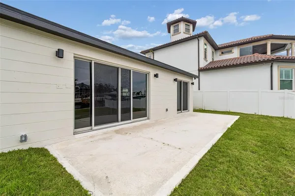 a view of a lake with couches and city view