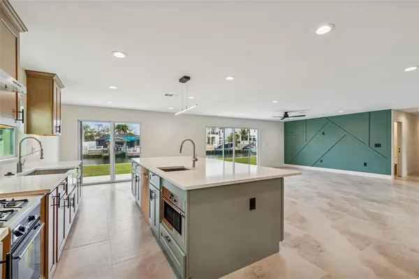a kitchen with a sink and stove