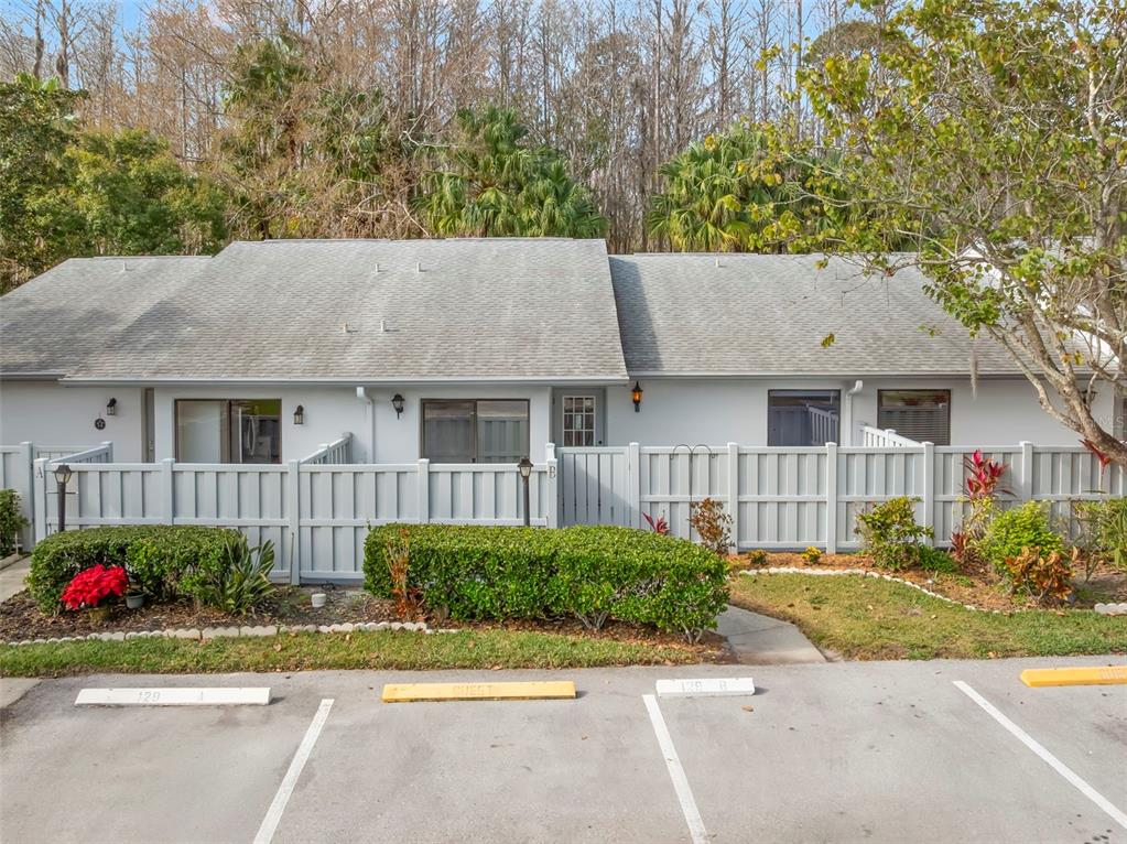 1371 Pine Ridge Circle East, Unit B Tarpon Springs, FL 34688 - Photo 1 of 1 a house view with a garden space