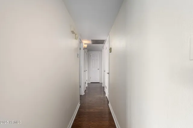 a view of a hallway with a white walls