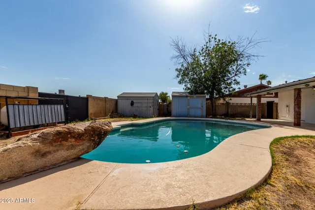a view of a backyard with a tub
