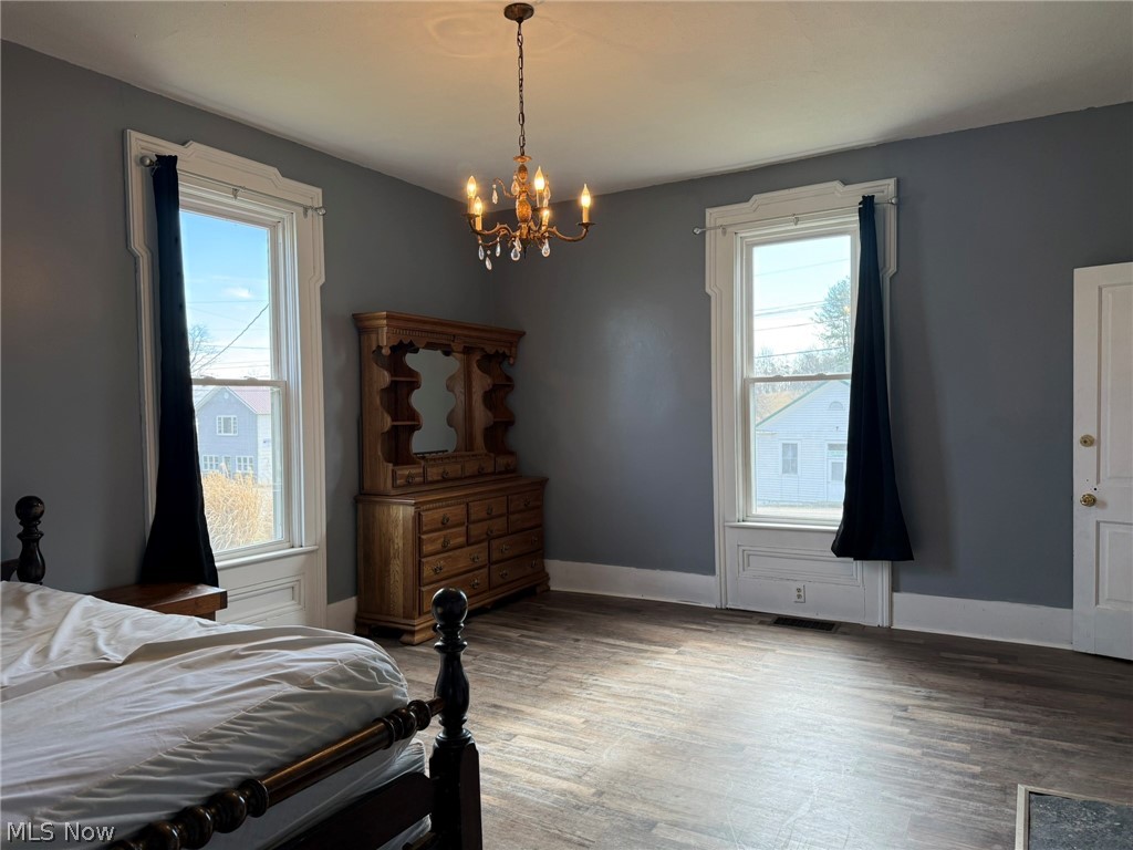23033 Cadiz Road Freeport, OH 43973 - Photo 11 of 31 Bedroom with light wood-style flooring and suspended lighting