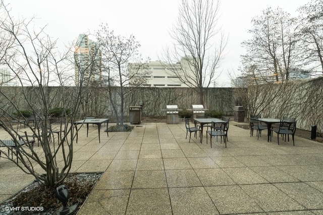 800 Elgin Road, Unit 519 Evanston, IL 60201 - Photo 12 of 17 a view of a tables and chairs in a patio