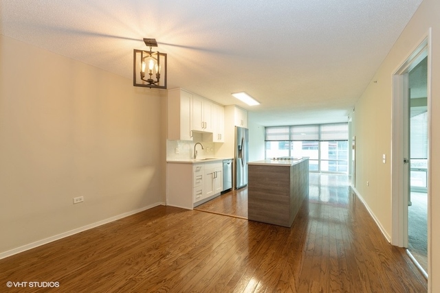 800 Elgin Road, Unit 519 Evanston, IL 60201 - Photo 4 of 17 a view of kitchen and wooden floor