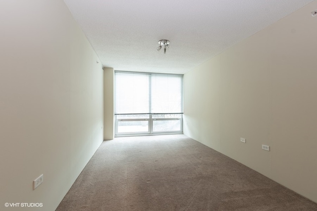 800 Elgin Road, Unit 519 Evanston, IL 60201 - Photo 6 of 17 a view of an empty room with a window