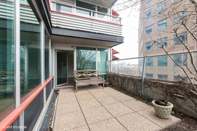 800 Elgin Road, Unit 519 Evanston, IL 60201 - Photo 10 of 17 a view of a balcony with chairs and a potted plant
