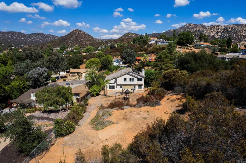 24427 Novato Place Ramona, CA 92065 - Photo 12 of 54 a view of a house with a mountain