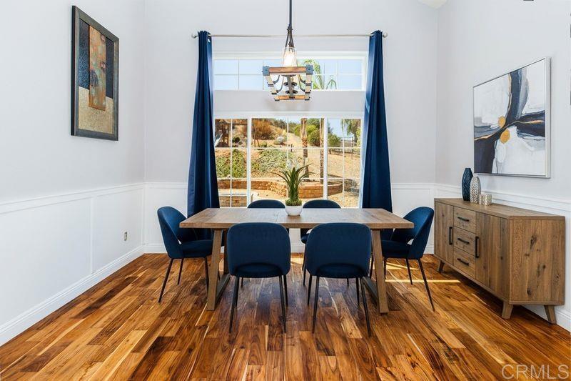 24427 Novato Place Ramona, CA 92065 - Photo 22 of 54 a view of a dining room with furniture window and wooden floor