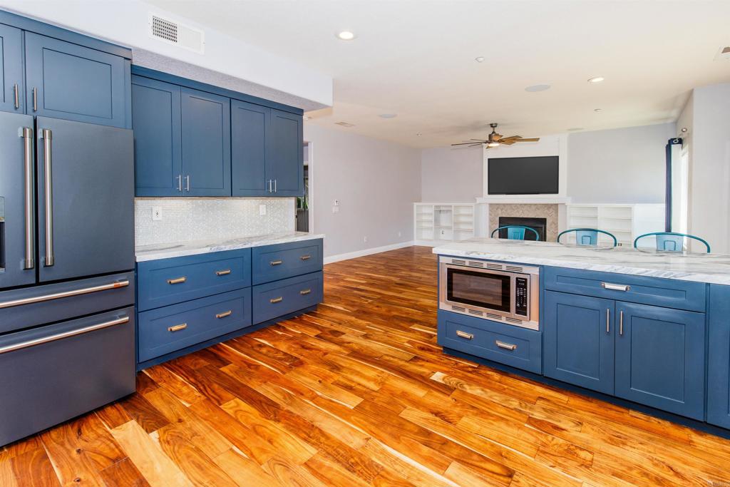 24427 Novato Place Ramona, CA 92065 - Photo 26 of 54 a spacious bathroom with a granite countertop sink and a mirror