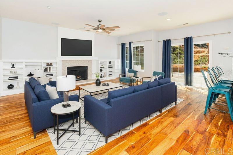 24427 Novato Place Ramona, CA 92065 - Photo 29 of 54 a living room with furniture and a fireplace
