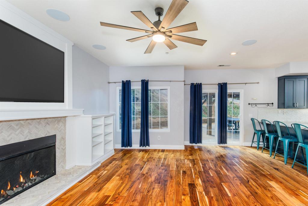24427 Novato Place Ramona, CA 92065 - Photo 30 of 54 a bedroom with a bed and a flat screen tv