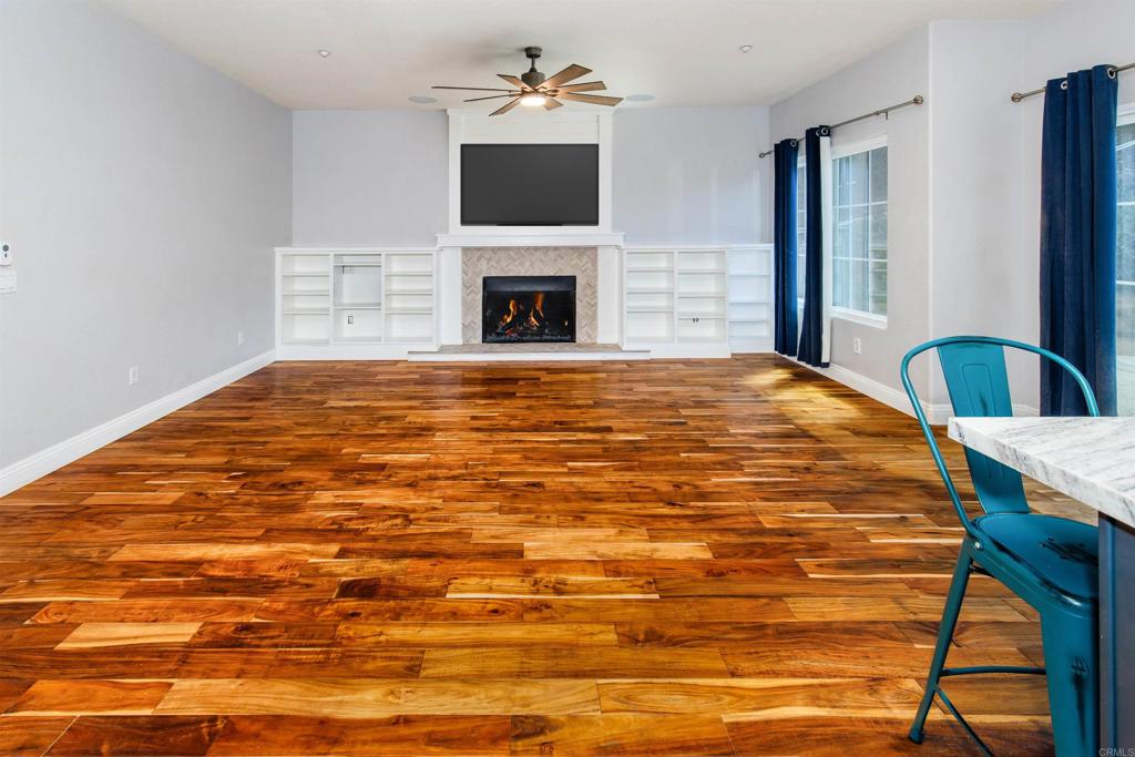 24427 Novato Place Ramona, CA 92065 - Photo 31 of 54 a bedroom with a bed and a flat screen tv