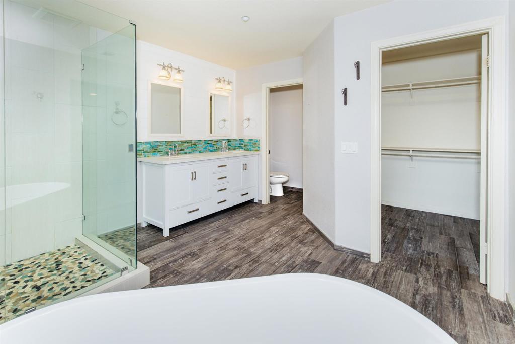 24427 Novato Place Ramona, CA 92065 - Photo 36 of 54 a view of a bedroom with wooden floor and cabinet