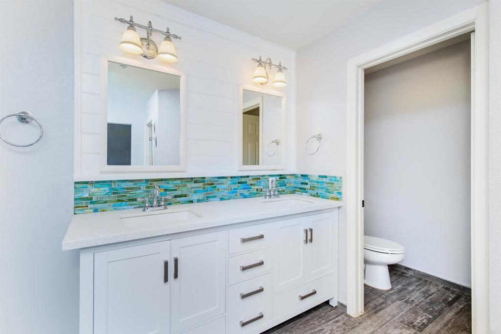 24427 Novato Place Ramona, CA 92065 - Photo 37 of 54 a bathroom with a sink and a mirror