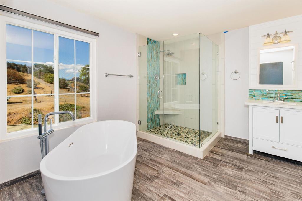 24427 Novato Place Ramona, CA 92065 - Photo 40 of 54 a bathroom with a bathtub and a sink
