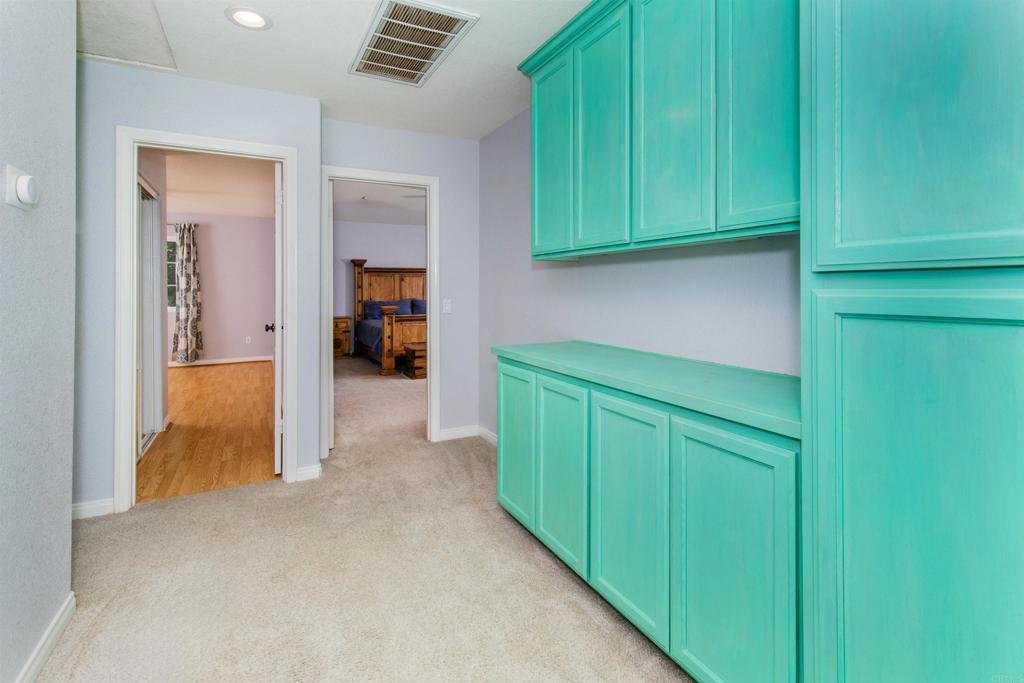 24427 Novato Place Ramona, CA 92065 - Photo 46 of 54 a view of a kitchen with fridge and dishwasher