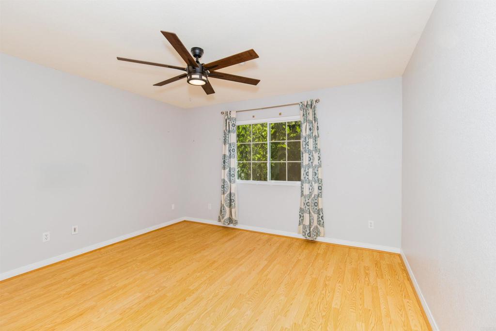 24427 Novato Place Ramona, CA 92065 - Photo 47 of 54 a view of a big room with wooden floor and windows