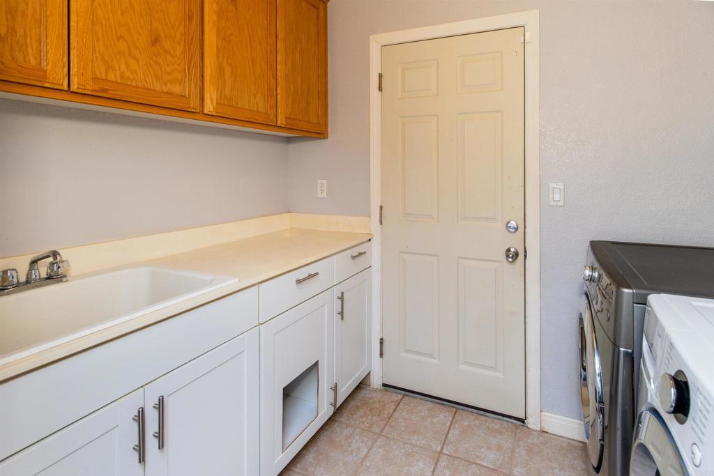 24427 Novato Place Ramona, CA 92065 - Photo 50 of 54 a room with storage and utility