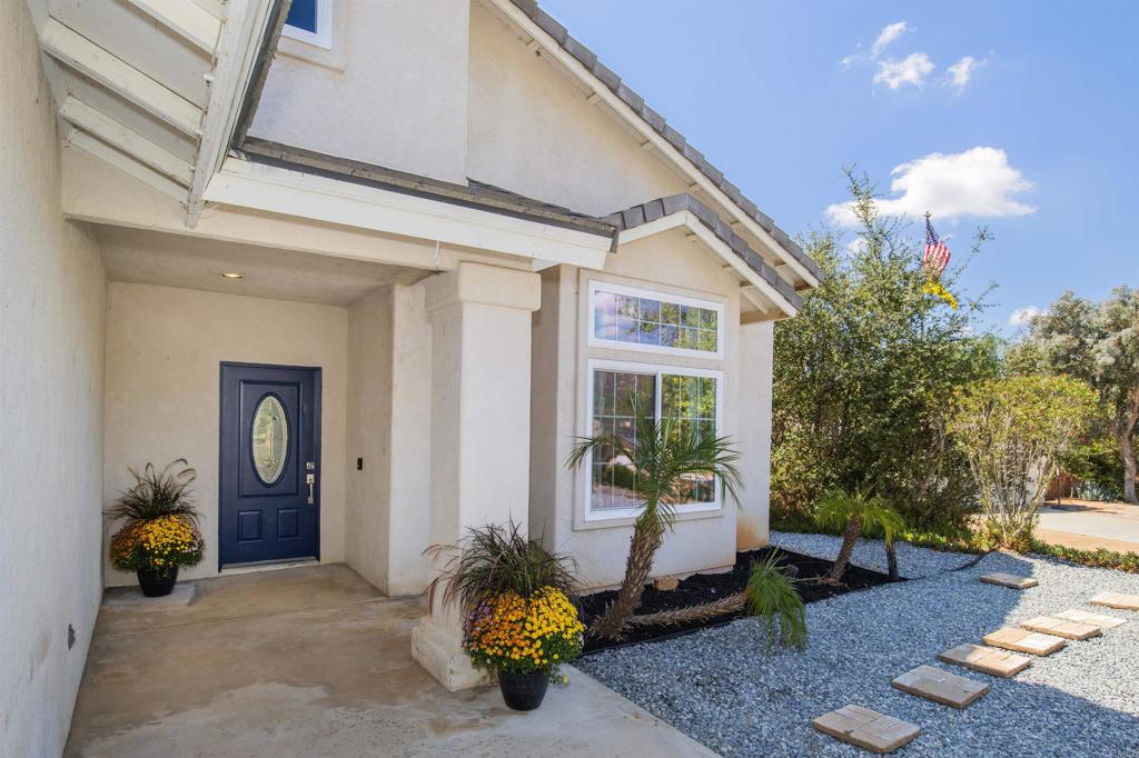 24427 Novato Place Ramona, CA 92065 - Photo 5 of 54 a front view of a house with outdoor seating
