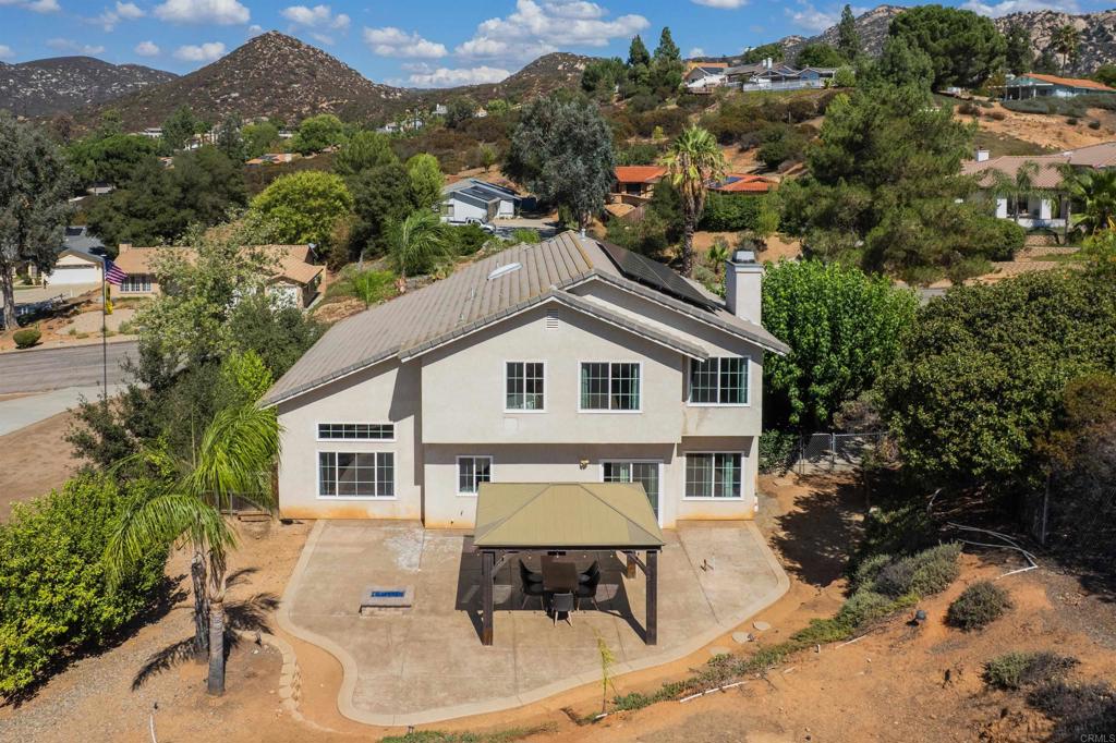 24427 Novato Place Ramona, CA 92065 - Photo 6 of 54 a house with a outdoor space