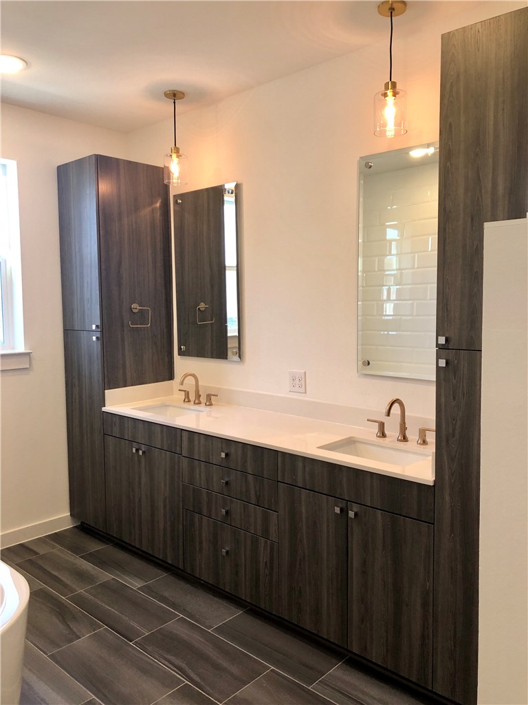 2624 Metcalfe Road, Unit 6 Austin, TX 78741 - Photo 7 of 14 The Master bathroom has double vanities, a soaking tub and a walk-in shower