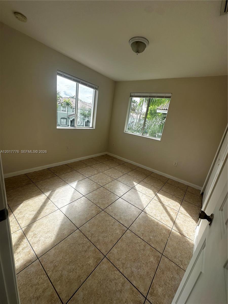 2907 Southeast 15th Road, Unit 67 Homestead, FL 33035 - Photo 13 of 25 a view of an empty room with a window