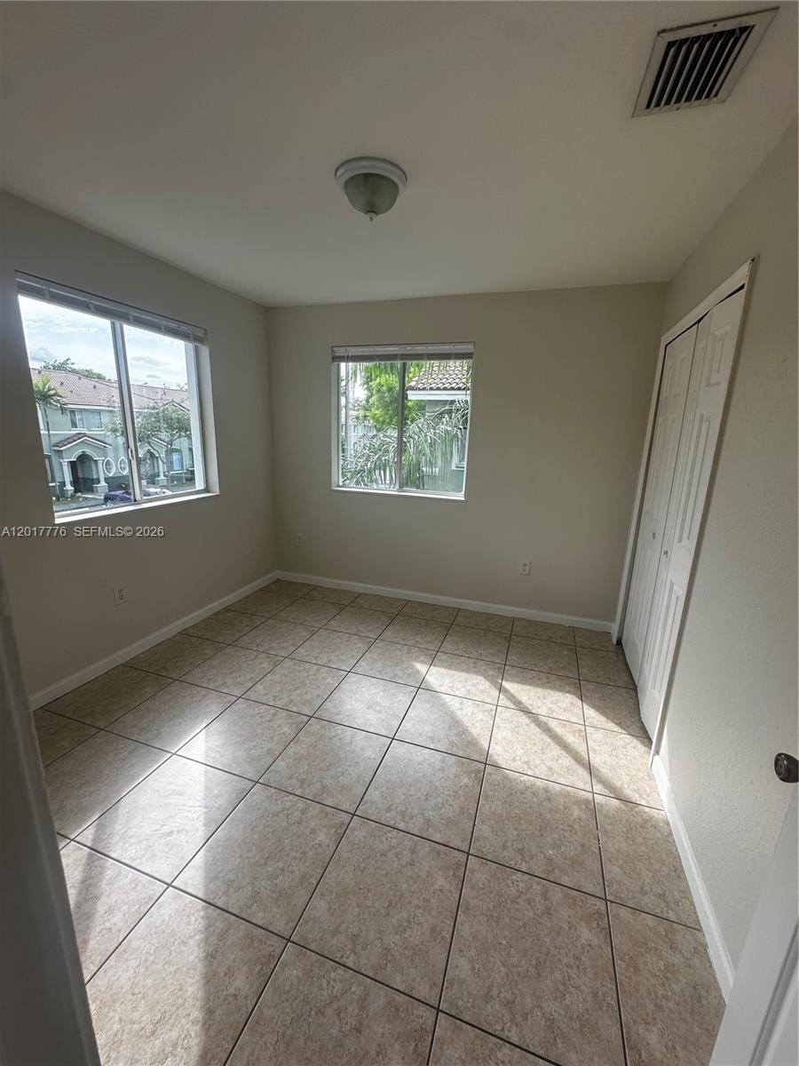 2907 Southeast 15th Road, Unit 67 Homestead, FL 33035 - Photo 14 of 25 a view of an empty room with a window