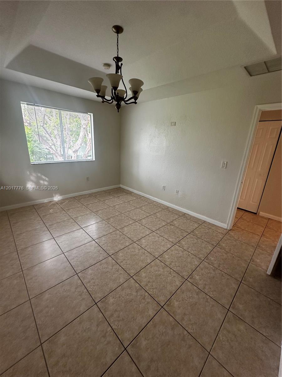 2907 Southeast 15th Road, Unit 67 Homestead, FL 33035 - Photo 15 of 25 an empty room with windows and fan