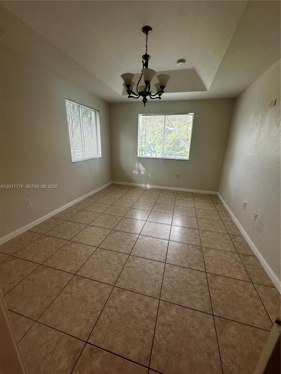 2907 Southeast 15th Road, Unit 67 Homestead, FL 33035 - Photo 17 of 25 a view of an empty room and window