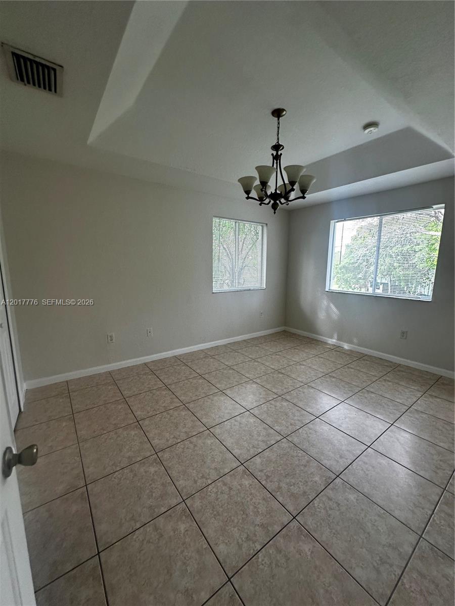 2907 Southeast 15th Road, Unit 67 Homestead, FL 33035 - Photo 23 of 25 a view of an empty room and window